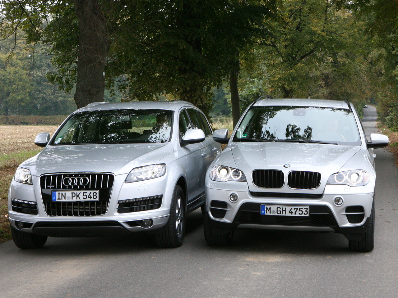 bmw x5 или audi q7